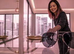 Woman picking up her glasses