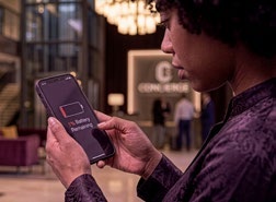 Woman checking her phone battery