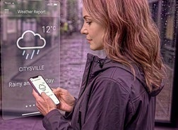 Woman checking the weather on her phone